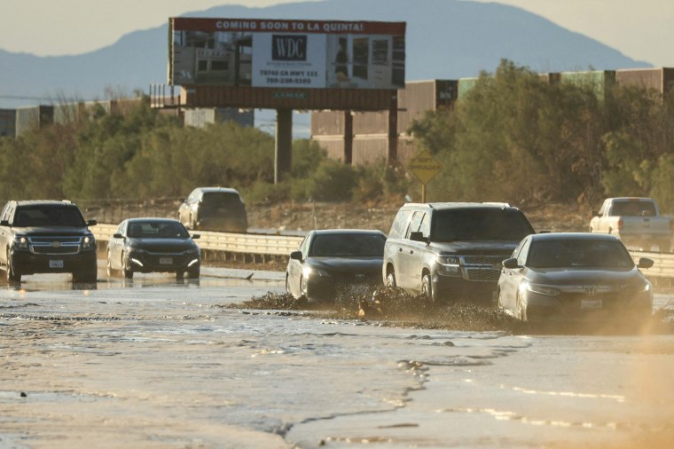 Traffic is slowed as water and mud from Tropical Storm Hilary covers part of Interstate 10 between Indio and Palm Springs, Calif., on Aug. 21, 2023.