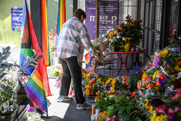 Image: A resident leaves flowers at a makeshift memorial outside the Mag.Pi clothing store in Cedar Glen, near Lake Arrowhead, Calif., on Aug. 21, 2023. 