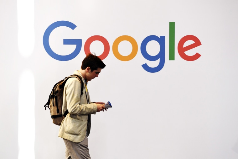 A man walks past the Google logo at the VivaTech trade fair in Paris in 2018. 