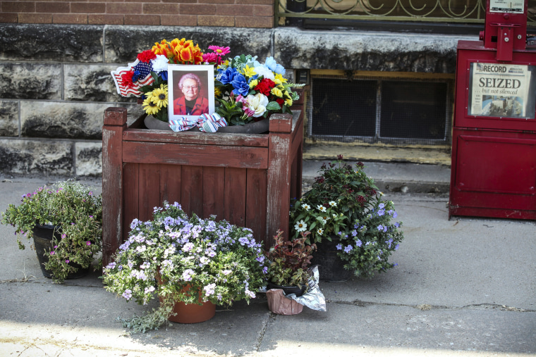 Image: A tribute to Joan Meyer, the late 98-year-old co-owner of the Marion County Record, sits outside the weekly newspaper's office, on Aug. 11, 2023, in Marion, Kan.