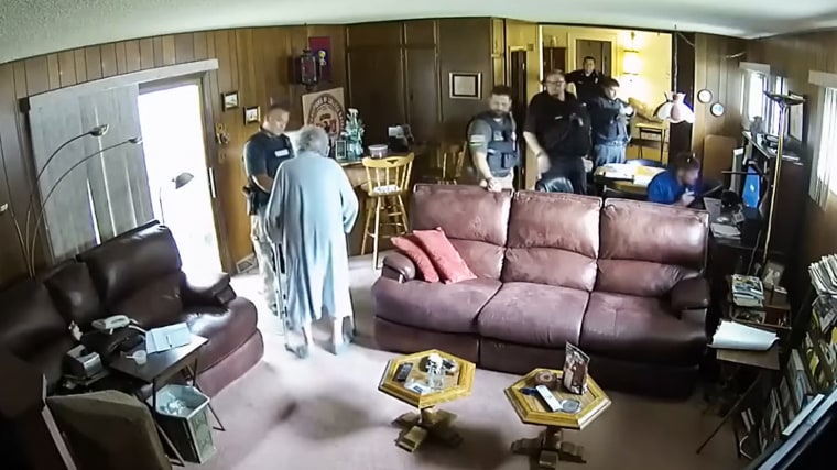 Joan Meyer, co-owner of the Marion County Record, swears at police officers in her home on Aug. 11, 2023.