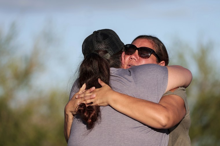 A woman embraces her friend after having found her safe in Maui, Hawaii, on Aug. 19, 2023.
