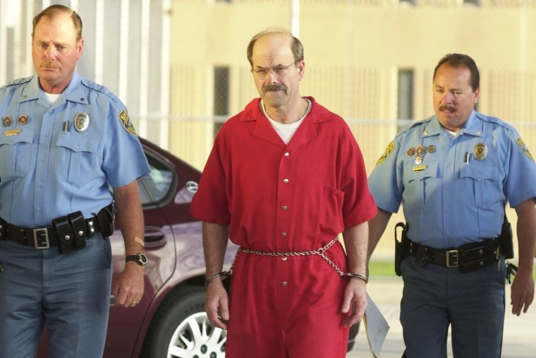 Convicted serial killer Dennis Rader, known as the BTK strangler, walks into the El Dorado Correctional Facility in El Dorado, Kan., in 2005.