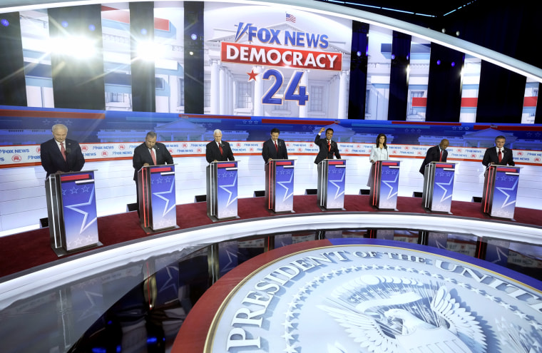 Image: Republican presidential candidates take the stage before the start of a primary debate hosted by Fox News in Milwaukee on Aug. 23, 2023.