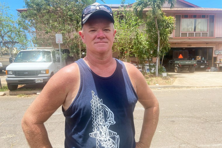 Todd Durrell, 48, is part of a small group of residents who have continued living at home in Lahaina after the devastating wildfire. He doesn’t want to leave home because he fears someone may burglarize the home.