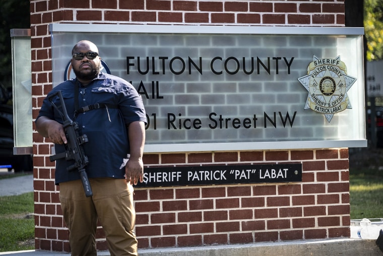 Image: An official stands guard in front of the Fulton County Jail in Atlanta on Aug. 24, 2023.