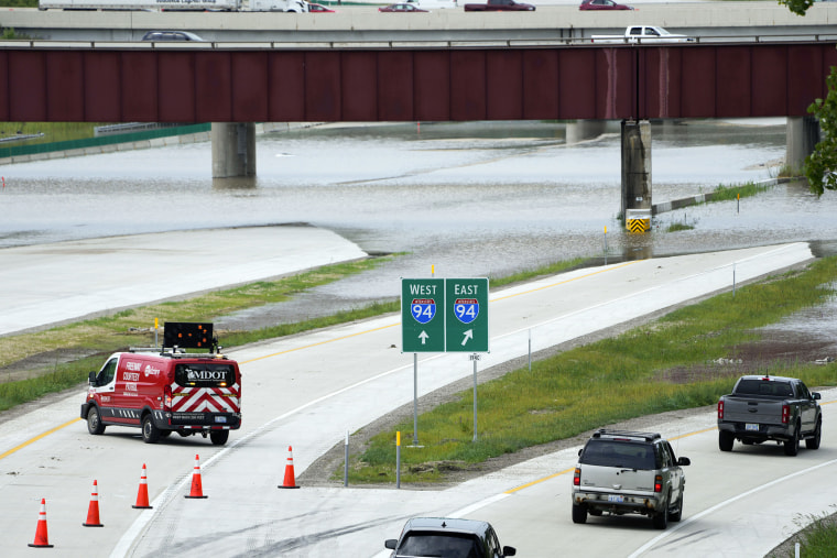 Traffic is redirected from I-275 after overnight flooding left vehicles stranded near the Detroit Metropolitan Airport in Romulus, Mich., Thursday, Aug. 24, 2023. 