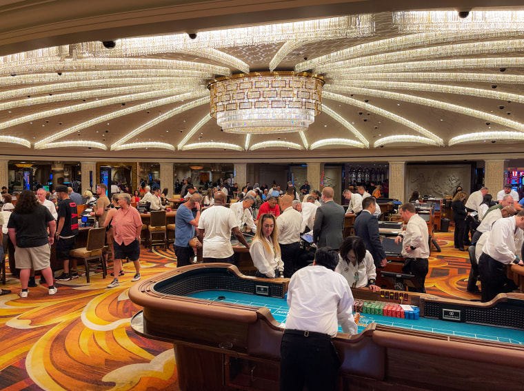 People gamble at Caesars Palace Hotel and Casino
