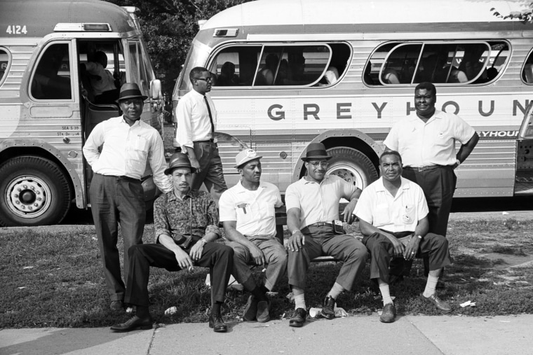 Civil Rights demonstrators, among them Warren H. Jennings, in front of parked buses during the March on Washington.