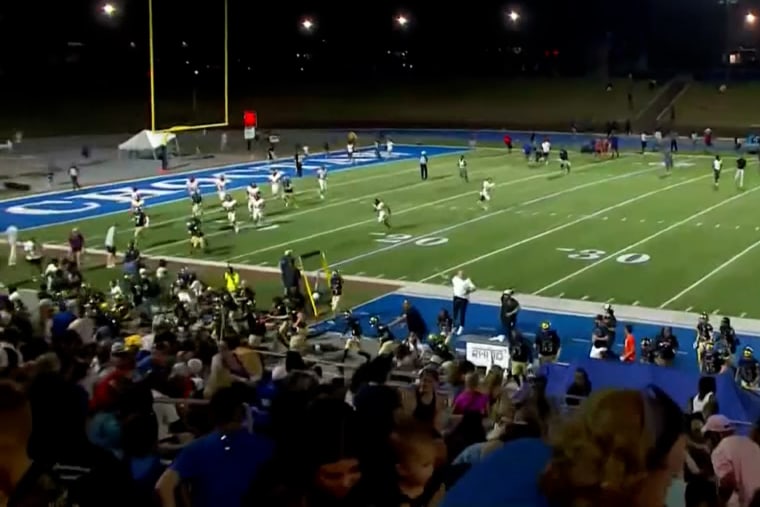 People run after shots were fired during a football game at Choctaw High School