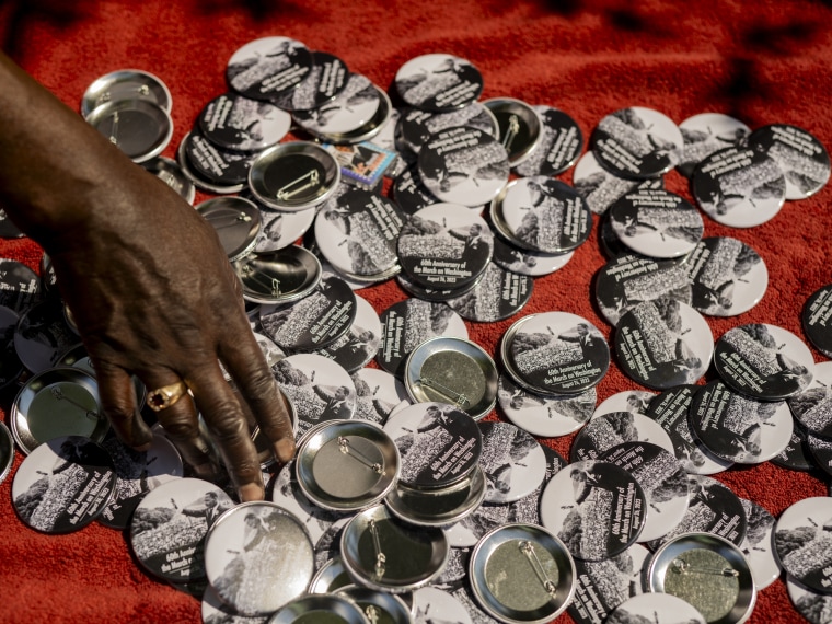 A pin merchant at the anniversary march. 