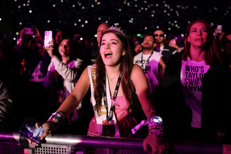 A fan watches Taylor Swift performs during the "The Eras Tour" in Mexico City, on August 24, 2023.