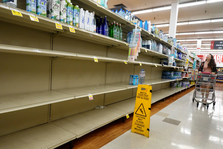 A grocery store's water section is almost bare as people stock up ahead of the possible arrival of Hurricane Idalia on Aug. 29, 2023 in Pinellas Park, Fla.
