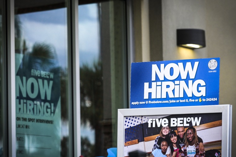A 'Now Hiring' sign advertising job openings outside of a Five Below store on Aug. 1, 2023, in Orlando, Fla.