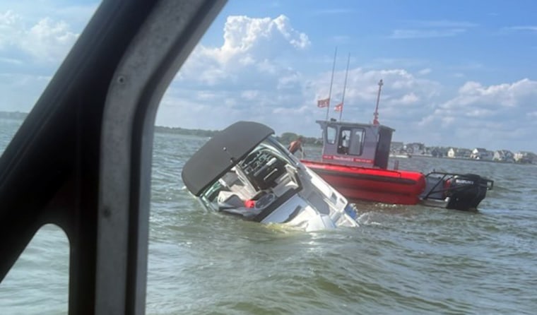 The Coast Guard rescued four people and a dog from a boat taking on water near Forked River, N.J.  