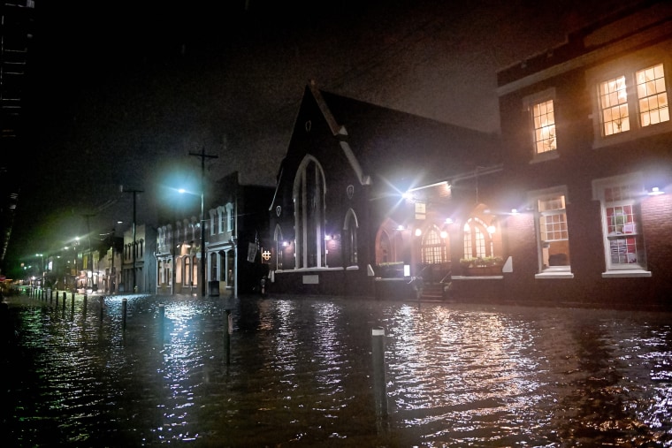 Streets around Charleston City Market floods as tides rise following tropical storm Idalia in Charleston, S.C., on Aug. 30, 2023.