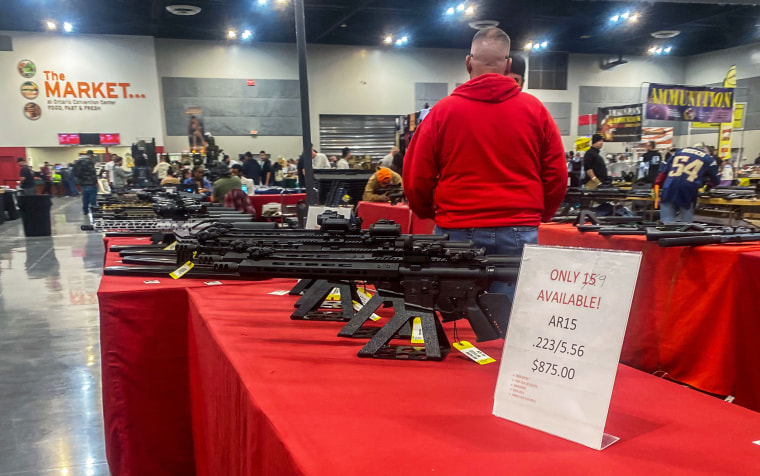 AR15 rifles are displayed for sale at a gun show