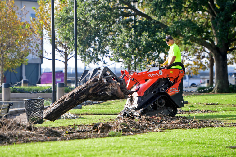 Crews remove logs and debris washed up from Tropical Storm Idalia in Charleston, S.C. on Aug. 31, 2023.