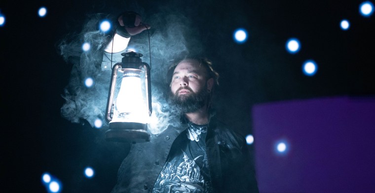Bray Wyatt holds a lantern