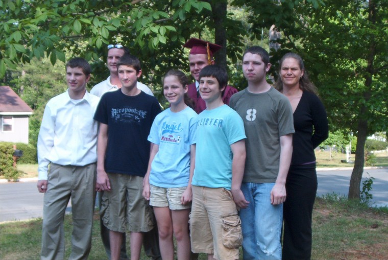 Justin Gaines on his graduation day with some of the members of his family.