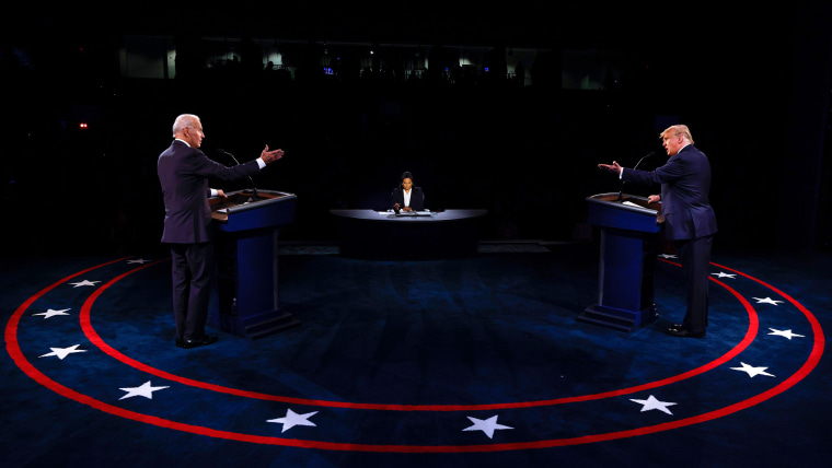 US President Donald Trump (R) Democratic Presidential candidate, former US Vice President Joe Biden and moderator, NBC News anchor, Kristen Welker (C) participate in the final presidential debate at Belmont University in Nashville, Tennessee, on October 22, 2020. 