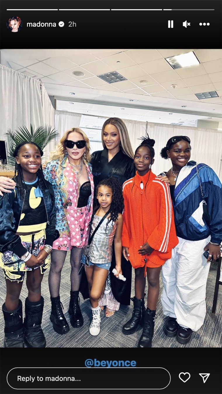Madonna poses with her daughters while Beyoncé poses with her daughter Rumi.