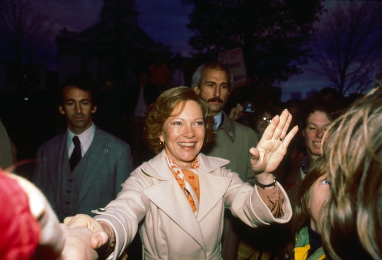 US First Lady Rosalynn Carter shakes hands and waves the other during a campaign event in New Hampshire on October 24, 1979.