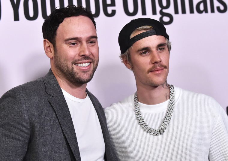 Scooter Braun (L) and Canadian singer Justin Bieber arrive for YouTube Originals' "Justin Bieber: Seasons" premiere at the Regency Bruin Theatre in Los Angeles on January 27, 2020.