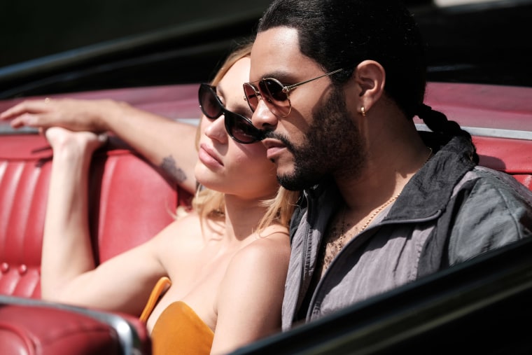 Lily Rose Depp and Abel "The Weeknd" Tesfaye in a red convertible in character for "The Idol"