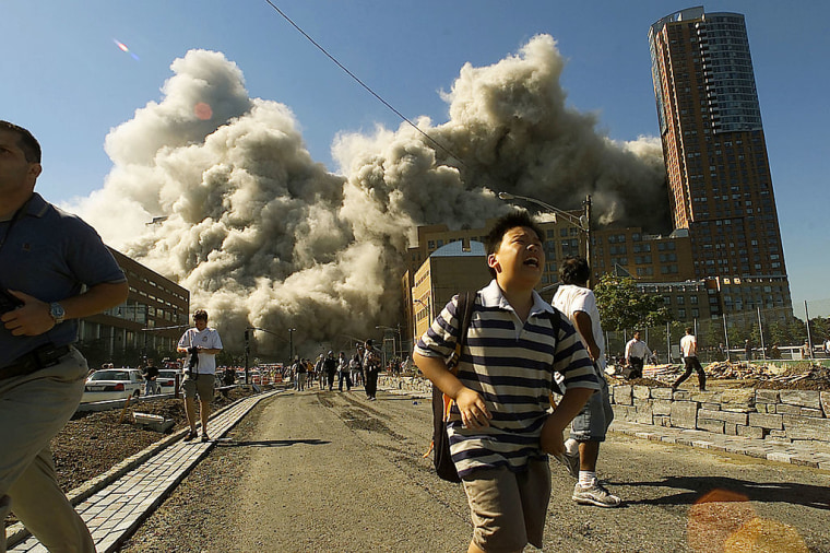 Gente huyendo de la zona de los ataques terroristas del 11 de septiembre de 2001. 