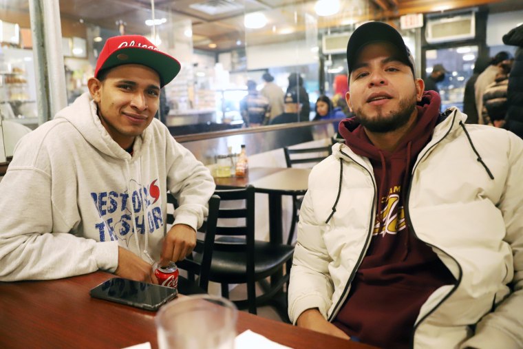 Carlos Niño, left, and Tonny Tavera in the Washington Heights neighborhood of  New York City in November 2022.