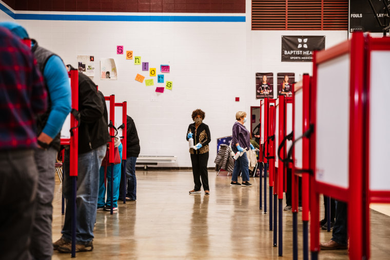 People vote during the Presidential election at a polling location