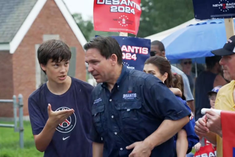 Quinn Mitchell with Ron DeSantis at a Fourth of July parade in Merrimack, N.H. 