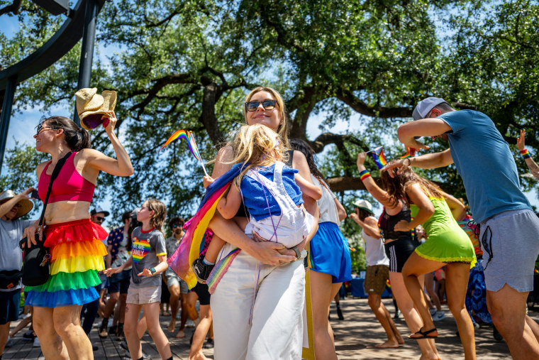 People dance during a drag time story hour in Austin, Texas