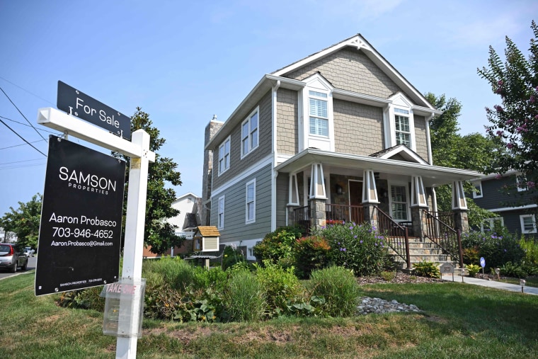 A for sale sign in front of a home in Arlington, Va., on Aug. 22, 2023. 