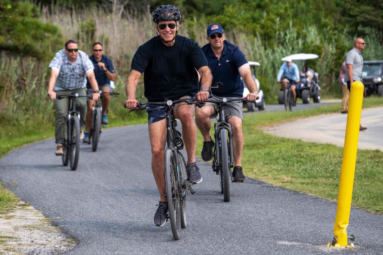 President Joe Biden rides his bike in Rehoboth Beach