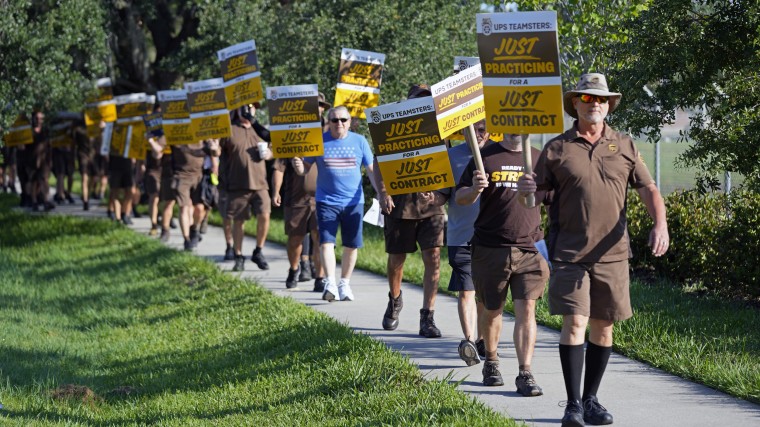 UPS workers go through a rehearsal strike at the UPS Customer Center, in Longwood, Fla, on July 13, 2023.