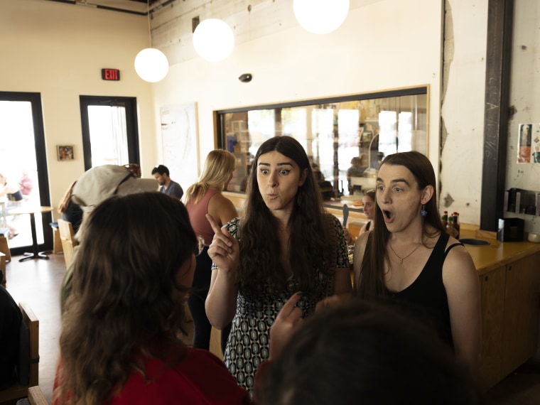 Rep. Zooey Zephyr and fiancée Erin Reed chat with a constituent at Cylde Coffee in Missoula, Mont., on Aug. 9, 2023.