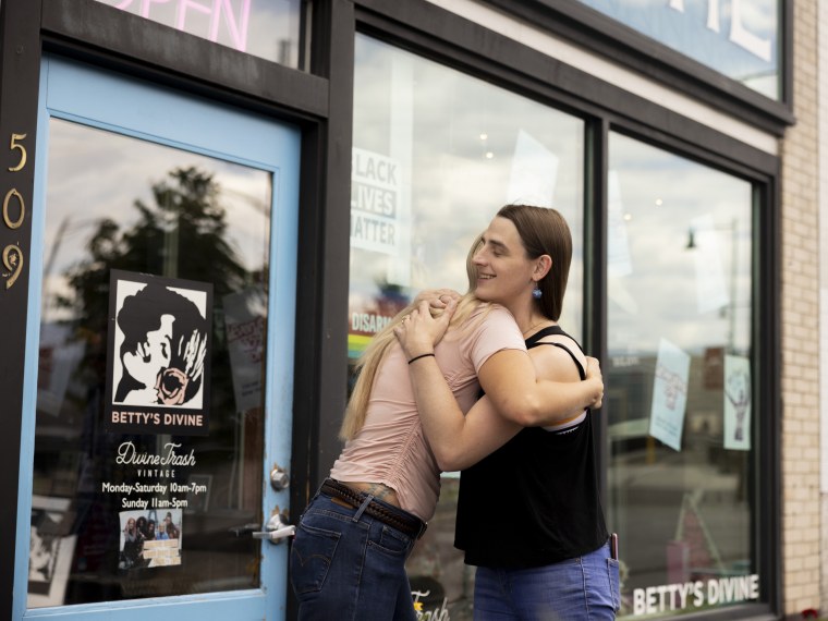 Rep. Zooey Zephyr hugs a constituent who stopped her to chat while walking through downtown Missoula, Mont., on Aug. 9, 2023.