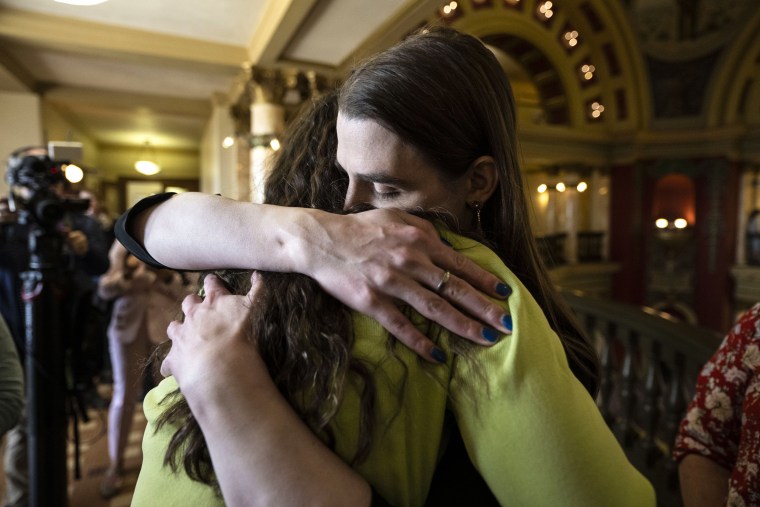 Rep. Zooey Zephyr hugs a supporter at the Montana State Capitol on April 26, 2023 in Helena, Montana.