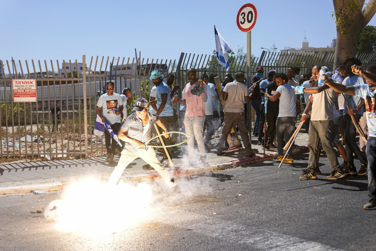 A stun grenade thrown by Israeli police explodes next to Eritrean protesters during a protest against an event organized by the Eritrea Embassy in Tel Aviv on Sept. 2, 2023.