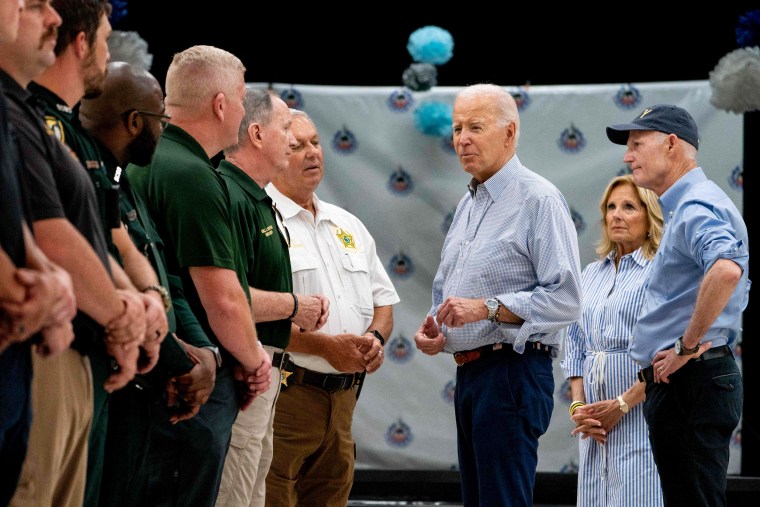 President Joe Biden greets first responders with Jill Biden and Republican Sen. Rick Scott in Live Oak, Fla., on Sept. 2, 2023.