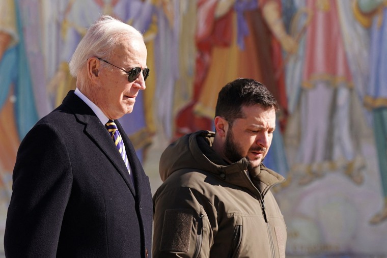(FILES) US President Joe Biden (L) walks next to Ukrainian President Volodymyr Zelensky (R) as he arrives for a visit in Kyiv on February 20, 2023. US President Joe Biden and Ukrainian leader Volodymyr Zelensky spoke August 24, 2023 about US plans to train Ukrainian pilots to fly F-16 fighter planes in the war with Russia, the White House said.