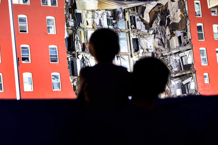 Family and friends of victims watch as search and rescue efforts continue on June 3, 2023, nearly a week after at a six-story apartment building partially collapsed.