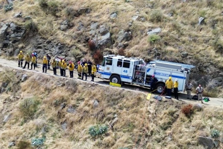 Emergency responders respond to a driver trapped in a ravine on Comanche Point Road in California on September 2, 2023.