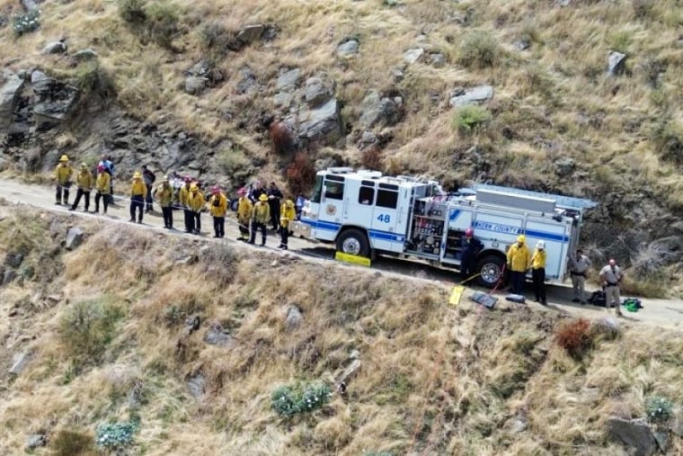 Emergency crews respond to a driver trapped in a ravine off Comanche Point Road in California on Sept. 2, 2023.