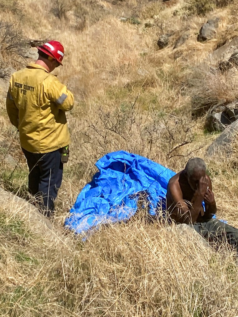 Emergency crews respond to a driver trapped in a ravine off Comanche Point Road in California on Sept. 2, 2023.