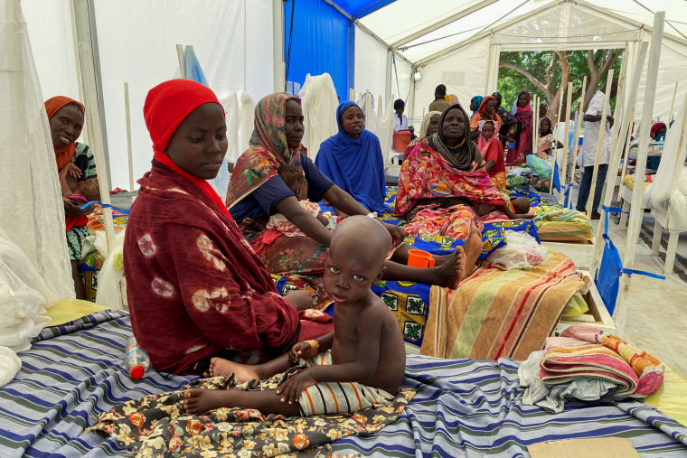 Patients sit on the beds at a makeshift MSF hospital  on the day U.S. Ambassador to the United Nations Thomas-Greenfield visited the hospital, in Adre