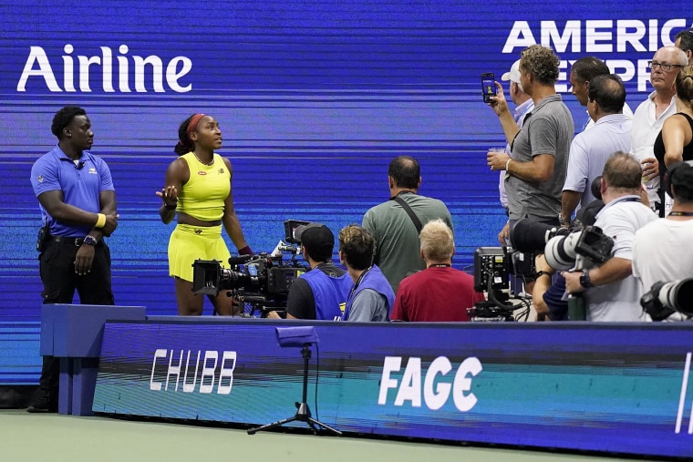 Coco Gauff, of the United States, reacts as protestors disrupt play between Gauff and Karolina Muchova, of the Czech Republic, during the women's singles semifinals of the U.S. Open tennis championships, Thursday, Sept. 7, 2023, in New York.