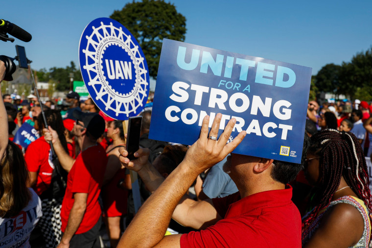 United Auto Workers members and others gather for a rally after marching in the Labor Day parade in Detroit on Sept. 4, 2023.
